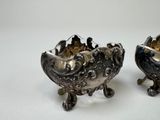 pair of antique silver plated sugar and pepper shakers