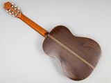 a close up of an acoustic guitar on a white background