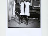 black and white photograph of two women standing next to each other