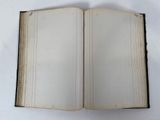 an open book on a table with a white background