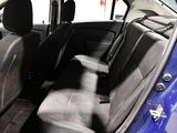 a blue car that is sitting in the back of the car