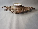 a clock that is sitting on top of a table