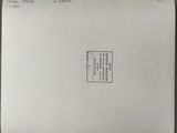 an envelope with a stamp on it sitting on a table