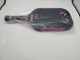 a paddle that is wrapped in plastic on a table