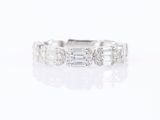 a white gold ring with baguets and diamonds