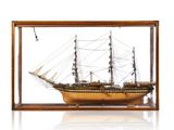 wooden model of a tall ship in a glass case