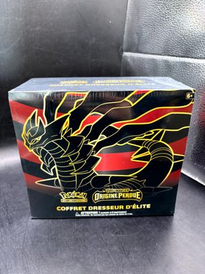 a close up of a box of pokemon cards on a table