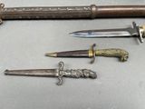several different types of knives are displayed on a table
