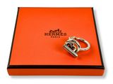 a close up of an orange box with a ring on it