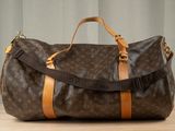 a brown and tan duffel bag sitting on a table
