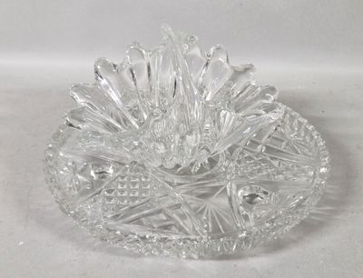 a clear glass bowl with a flower inside of it
