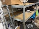 a workbench in a garage with tools on it