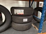 several tires are stacked on top of each other in a warehouse