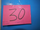 a pink sign with the number 30 written on it