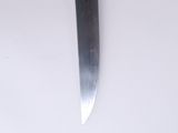a knife that is laying on a white surface