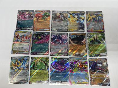 a close up of a bunch of pokemon cards on a table