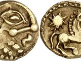 a gold coin with an image of a horse on it
