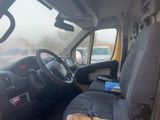 a picture of a car that has a stuffed animal in the front seat