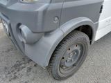 a close up of the front of a truck with a flat tire