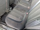 an image of a dirty car with the seats down