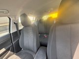 the back seats of a car with a yellow light in the back of it