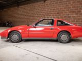 an image of a red car parked in a garage