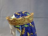a figurine of a woman wearing a crown on her head