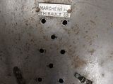 a close up of a metal object with holes in it