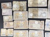 several different types of paper money laid out on a table