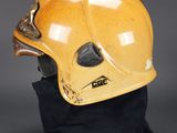 an image of a helmet on a black cloth on a gray background
