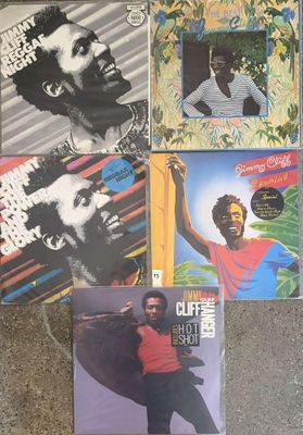 several different album covers of a man with a beard and a red shirt