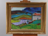 a painting on a easel with a painting of a landscape