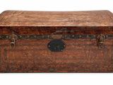 an old trunk that is sitting on a white surface