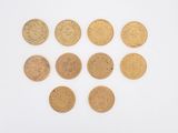 six different types of gold coins arranged in a circle