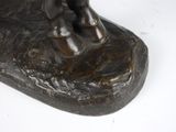a bronze statue of a man riding a horse
