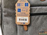 a bag with a tag attached to it ' s side