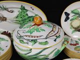 a lot of plates and bowls that have different designs on them