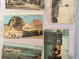 several old postcards of different types and sizes on a table