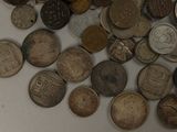 a pile of old coins sitting on a table
