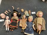 a lot of dolls that are sitting on a table