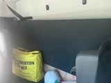 a bag of food sitting on the back of a van