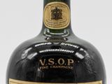 an image of a bottle of liquor sitting on top of a table