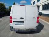 a white van parked on the side of the road