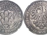 a close up of a coin with a lion on it