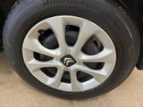 the tire of a car with a flat tire is shown