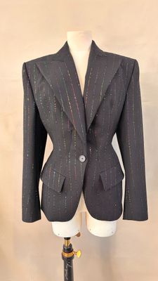 an image of a suit on a mannequin stand