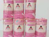 several jars of pink paint are stacked on top of each other