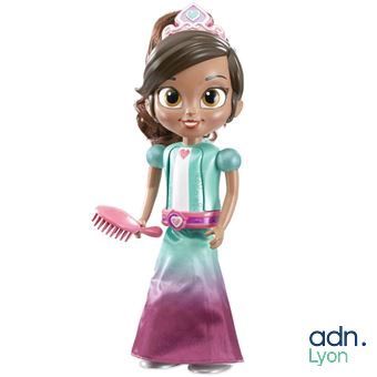 a doll that is holding a comb and a hairbrush