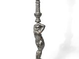 an image of a statue of a woman holding a lamp post