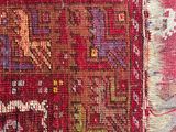 an image of a close up of a rug with a red background